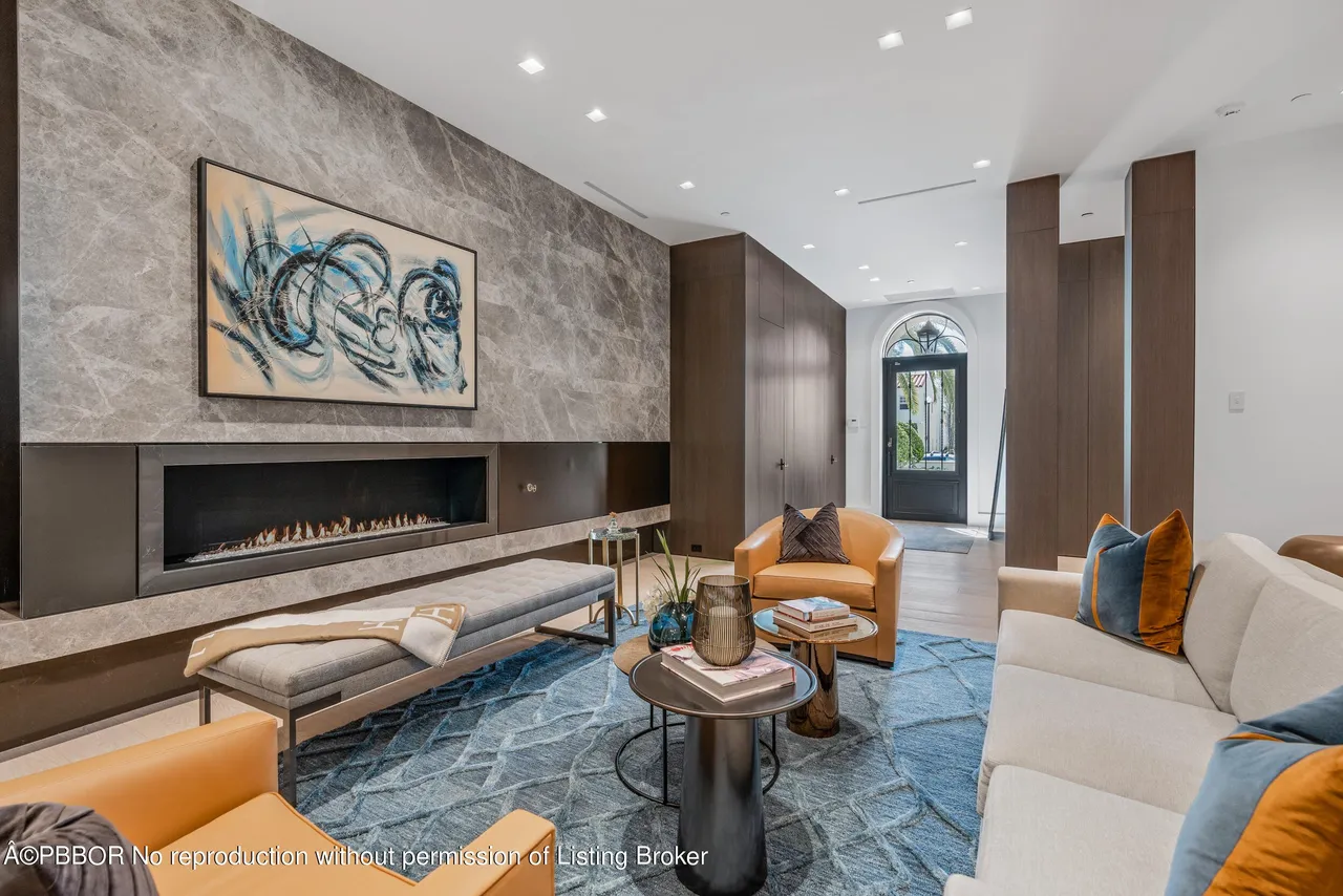 Marble floors and a sculptural fireplace